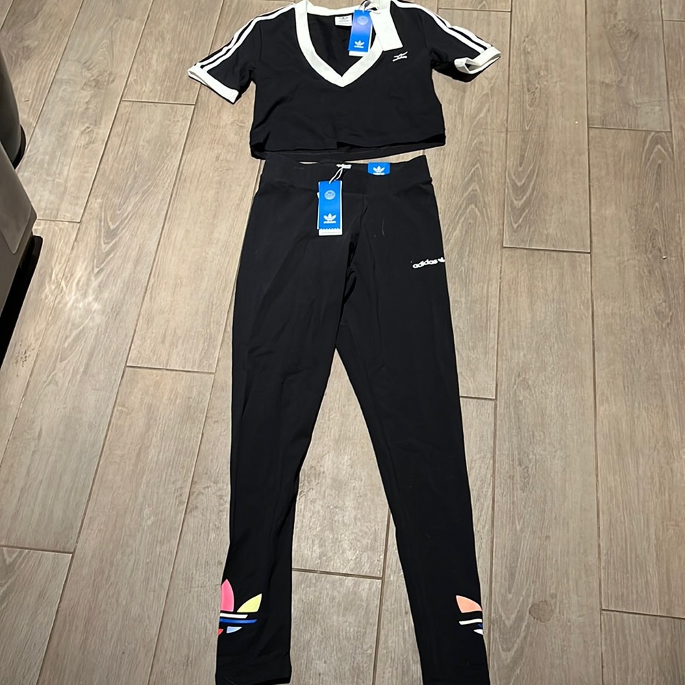 Girls adidas track suit.